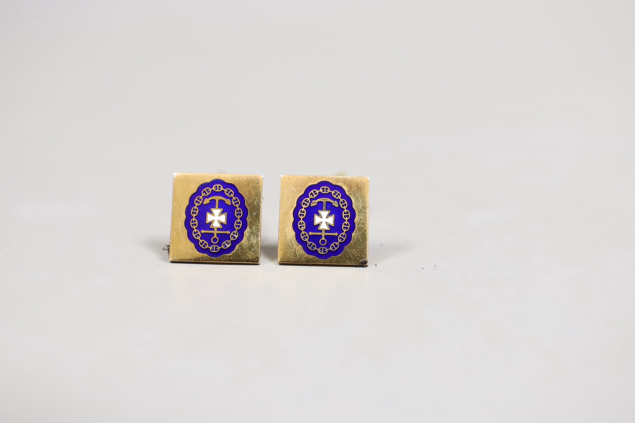 A pair of 585 and enamelled cufflinks, gross 13.8 grams and a yellow metal masonic stick pin.